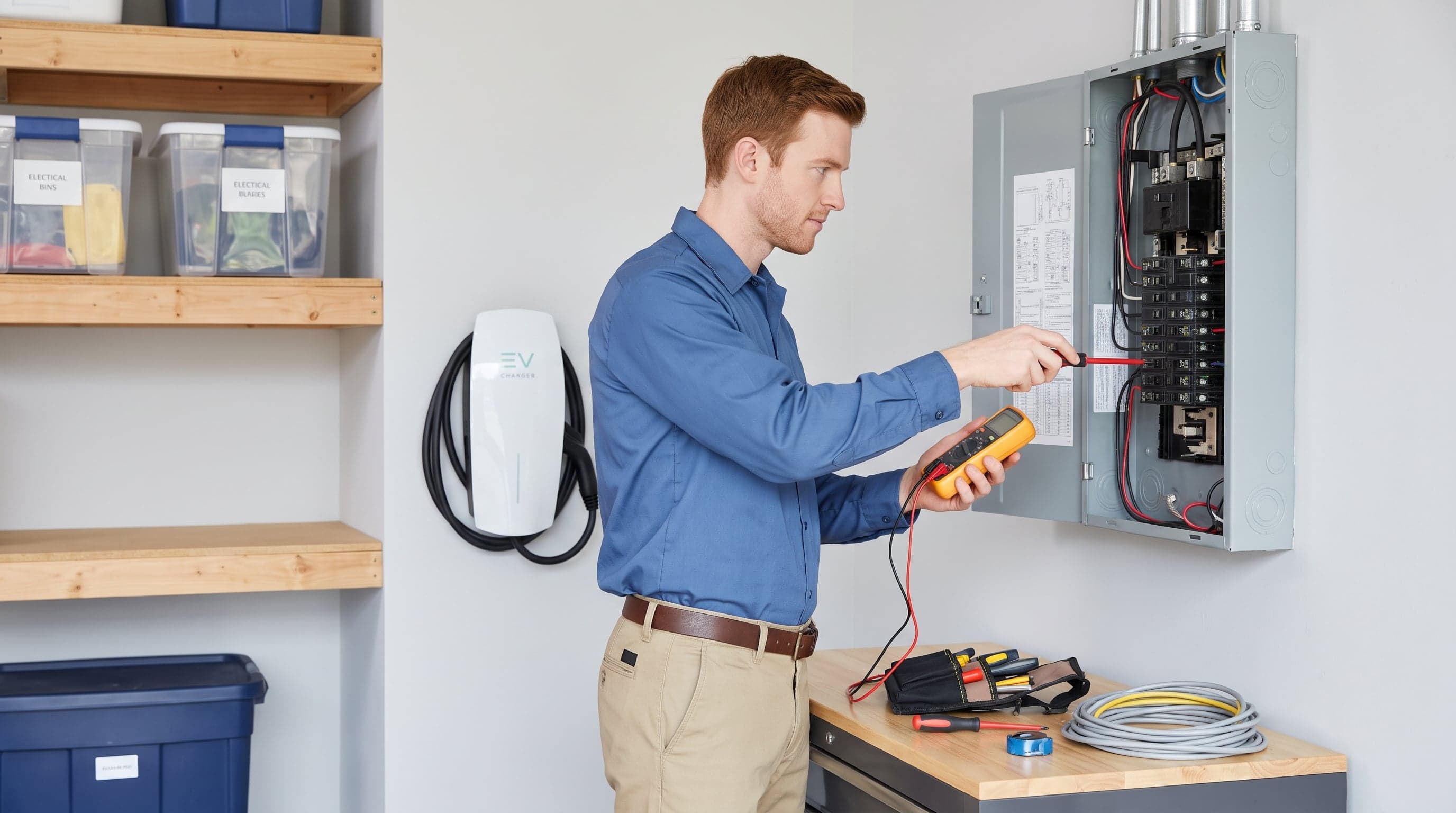 Electrician working on an electrical panel